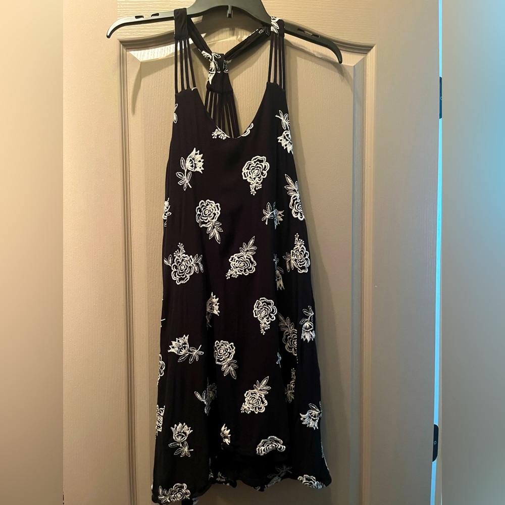 Black dress with white embroidered flowers. Size M